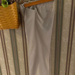 Attractive loose, straight leg, beige slacks in size 4P made by Worthington